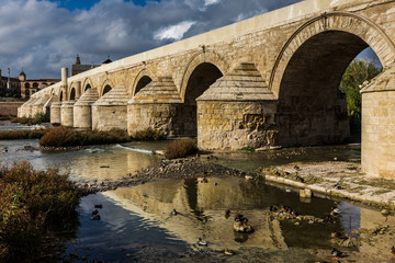 Guadalquivir river with the Roman bridge in Cordoba. Spain.