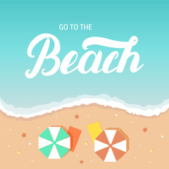 Go to the beach hand lettering on sea and sand background with umbrella deckchair.