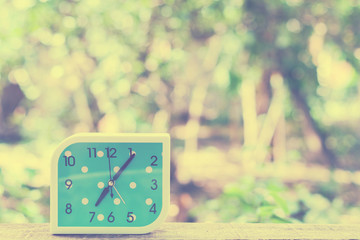 blue alarm clock on bokeh background,Close up blue alarm clock,vintage tone
