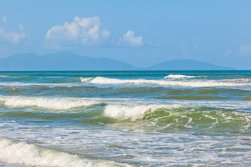 Summer seascape, waves and clouds