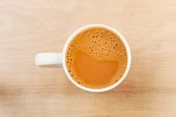 Printed kitchen splashbacks Tea Hot milk tea in a white cup on table