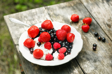 Open air breakfast - cottage cheese with berries