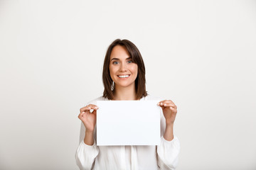 Naklejka premium Portrait of young successful business woman over white backgroun