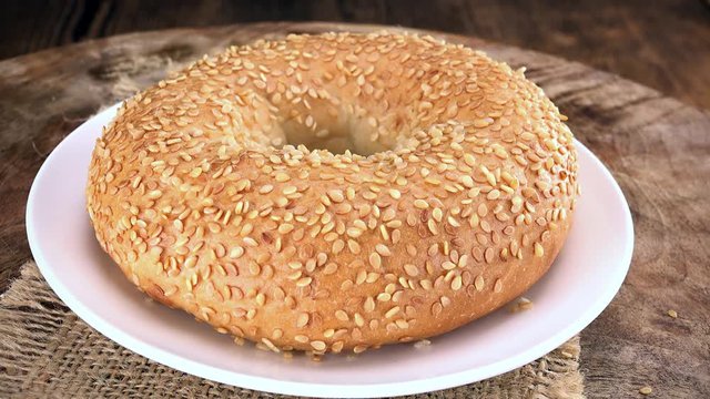 Portion of rotating Sesame Bagels as seamless loopable 4K UHD footage