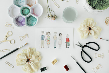 family with grandmother, parents and young couple painted with watercolor and bow tie clips, scissors, dry tulip, palette, succulent on white background. flat lay, top view
