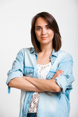 Portrait of young beautiful girl over white background.