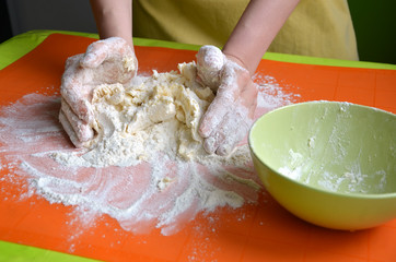 Process of making a dough from farina and butter on orange silicone pad