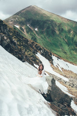 The bride in mountains. Wedding