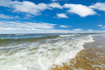 Baltic seascape with wavy water and blue sky