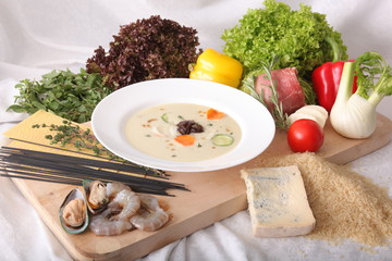 Italian vegetable soup, surrounded by fresh food