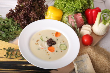 Italian vegetable soup, surrounded by fresh food