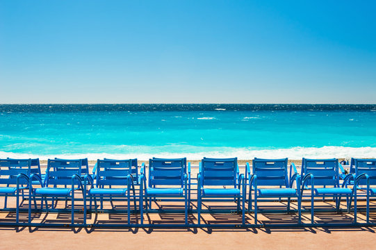 Blue chairs on the Promenade des Anglais in Nice, France