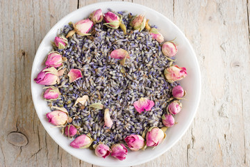 White bowl with dry lavender and rose flowers