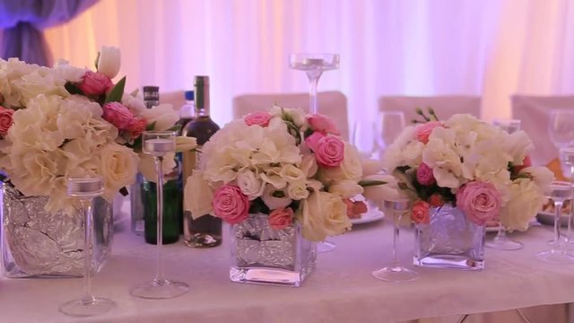 Interior of a wedding hall decoration ready for guests.Beautiful room for ceremonies and weddings.Wedding concept.Luxury stylish wedding reception purple decorations expensive hall