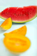 Slice of watermelon and melon on white background