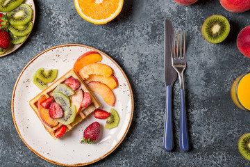 Breakfast waffles with fresh fruit.