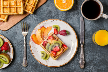Breakfast waffles with fresh fruit.