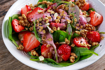 Summer Fruit Vegan Spinach Strawberry nuts Salad. concepts health food
