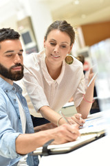 Colleagues in office checking agenda