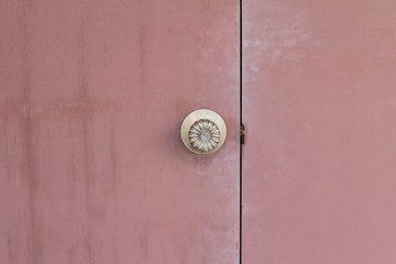 Background of door with lock in metal material and on wall.