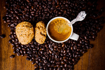 Cup of coffee with whole grains cookies