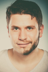 Obraz premium Young man with half shaved face beard hair.