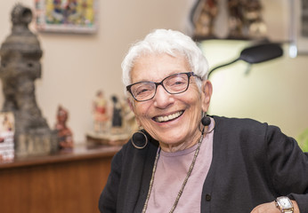 Older Independent Woman in her Apartment Smiling & Happy
