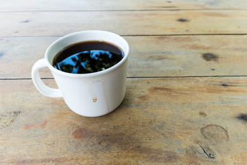 Cup of coffee on a wooden table