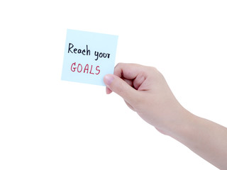 Single woman hold Reach your goal on notepad 1