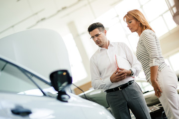 Customer looking at cars at dealership