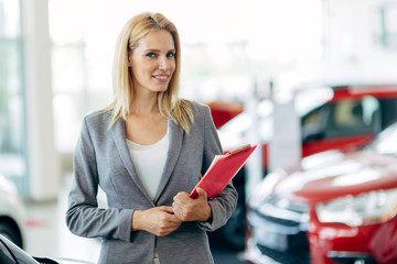 Professional salesperson in car dealership