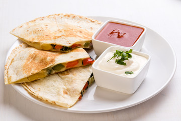 quesadilla slices on white plate