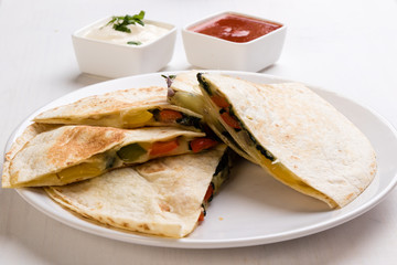 quesadilla slices on white plate