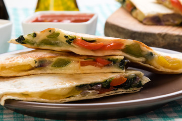 quesadilla slices on brown plate