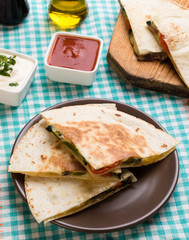 quesadilla slices on brown plate