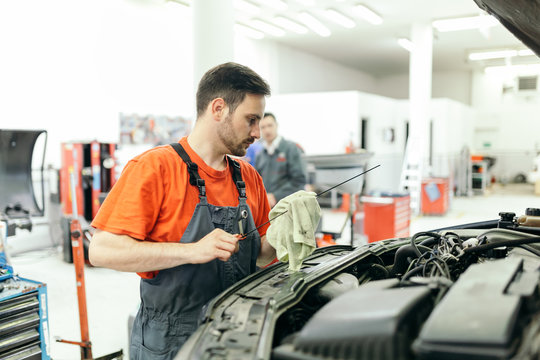 Car mechanic fixing a car