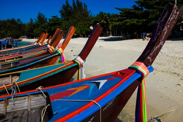 Fototapeta premium Longtail fishery and travel boat park on sand beach