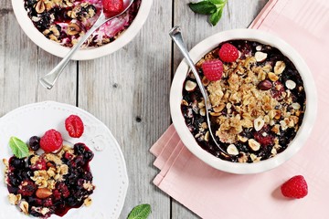 Berry crumble. Clean-eating gluten free dessert . Superfoods concept.Toned image, selective focus.