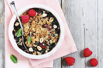 Berry crumble. Clean-eating gluten free dessert . Superfoods concept.Toned image, selective focus.