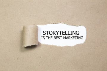 The motivational quote Storytelling is the best Marketing, appearing behind torn paper.