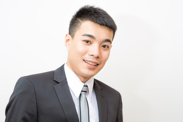 Asian handsome smart young business man on black suit smilling