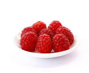 beautiful raspberries on white