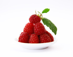 beautiful raspberries on white
