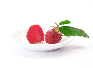 beautiful raspberries on white