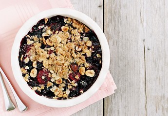 Berry crumble. Clean-eating gluten free dessert . Superfoods concept.Toned image, selective focus. 
