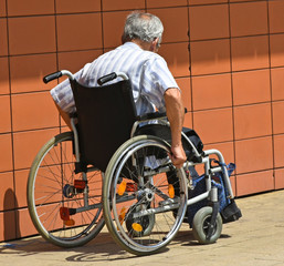 Old man in a wheelchair