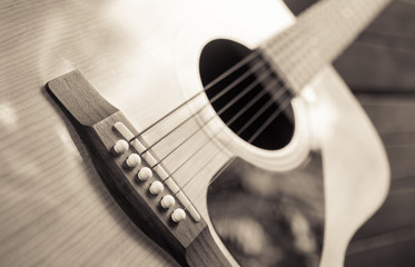 Fototapeta premium detail of classic guitar with shallow depth of field (vintage filter)