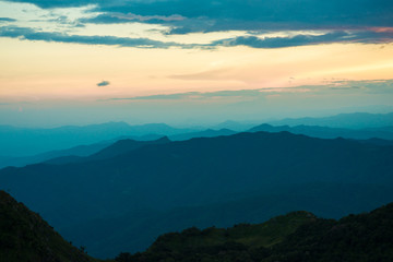 Obraz na płótnie Canvas Sunset in mountains over hills