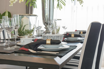 table set on wooden table in luxury dining room