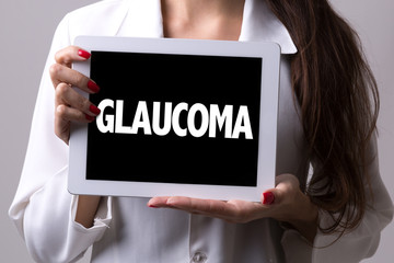 Female doctor holding a tablet with the text: Glaucoma